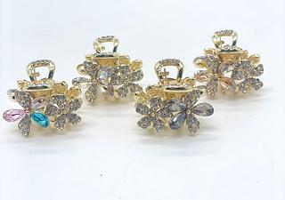 Presilha dourada formato flor strass (dúzia)